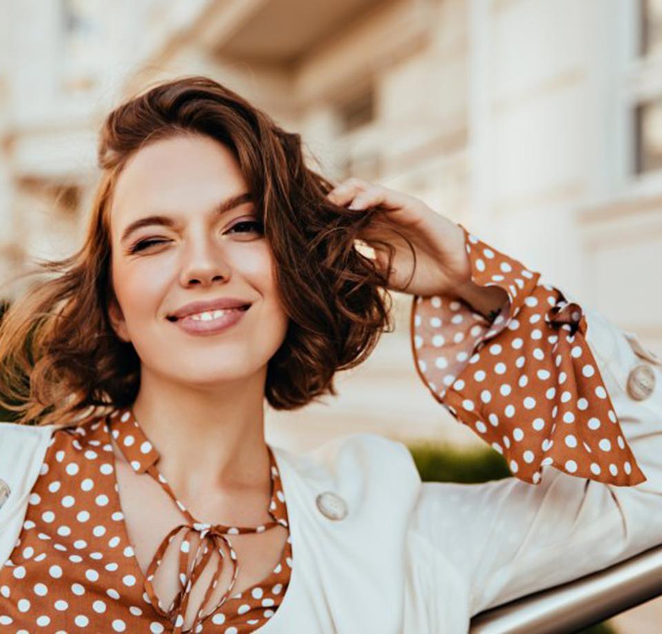  Woman smiling with her new dental crown