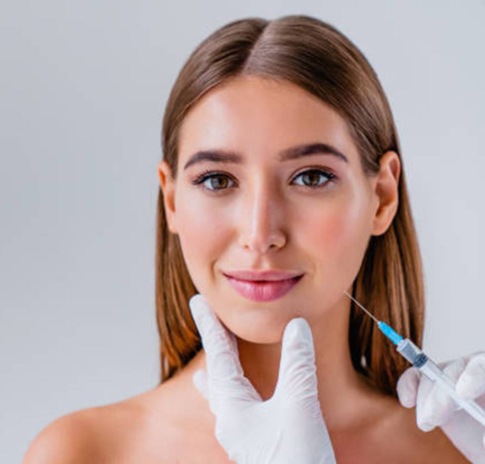 Woman receiving facial injection